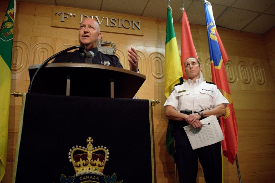 Regina Police Chief Evan Bray, left, speaks while Assistant Commissioner Rhonda Blackmore, right, looks on during a press conference at Royal Canadian Mounted Police Headquarters in Regina, Saskatchewan (Michael Bell/AP/PA) (AP)