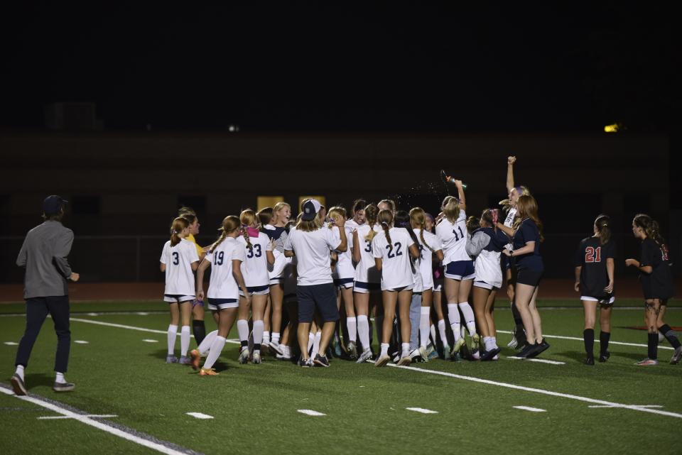 Snow Canyon girls soccer celebrates its Region 10 title following Ashlee Harris' game-winning goal.