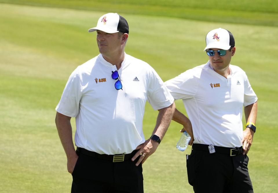 May 27, 2022; Scottsdale, Arizona, USA; Head coach Matt Thurmond and associate head coach Armen Kirakossian (right) of Arizona State watch David Puig play his shot on the first hole during round one of the NCAA DI Men's Golf Championships at Grayhawk Golf Club - Raptor Course.