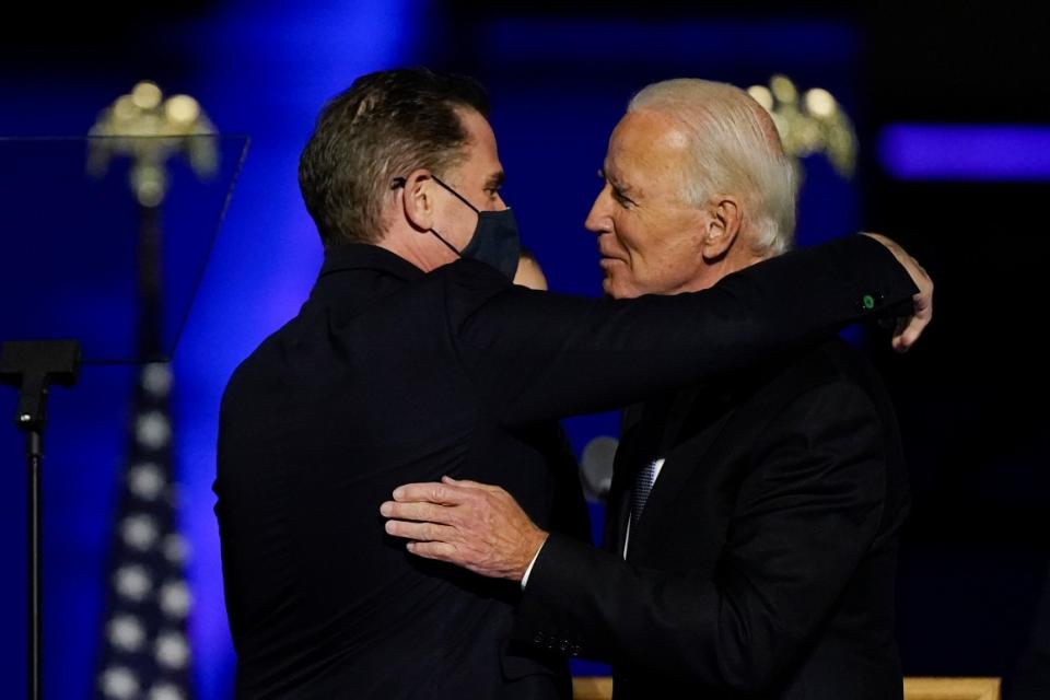 President-elect Joe Biden hugs his son Hunter Biden on stage Saturday, Nov. 7, 2020, in Wilmington, Del.