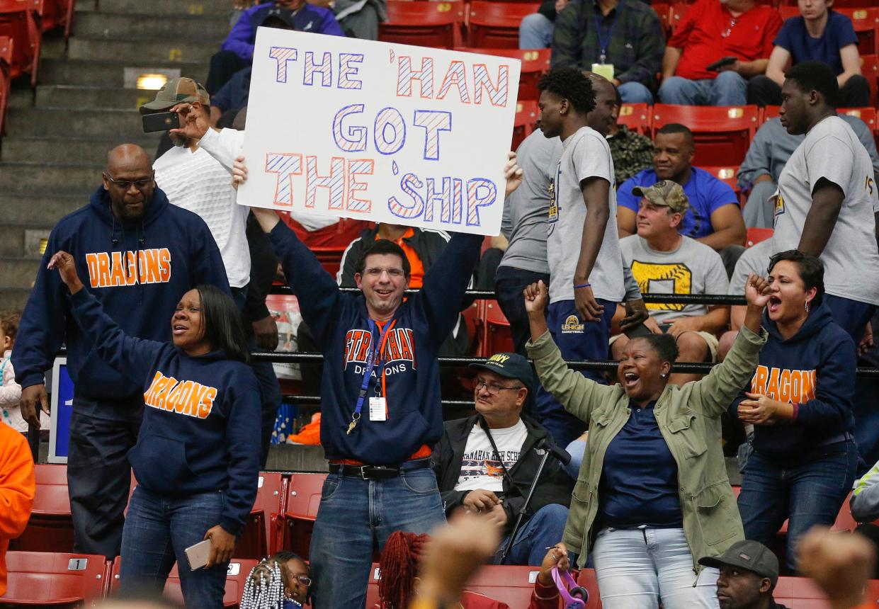 Fans cheer during a boys high school state championship tournament game at the RP Funding Center in Lakeland. The center implemented new bag policies last week, allowing only clear bags or small clutch purses.