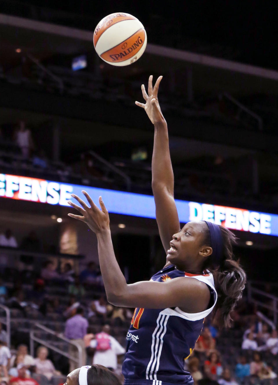 FILE - In an Aug. 16, 2012, file photo Connecticut Sun center Tina Charles goes up for a basket against the New York Liberty during the second half of a WNBA basketball game at the Prudential Center in Newark, N.J. People familiar with the situation say the Connecticut Sun have agreed to trade Tina Charles to New York for players to be named later and the Liberty's first round pick in 2015. (AP Photo/John Minchillo, File)
