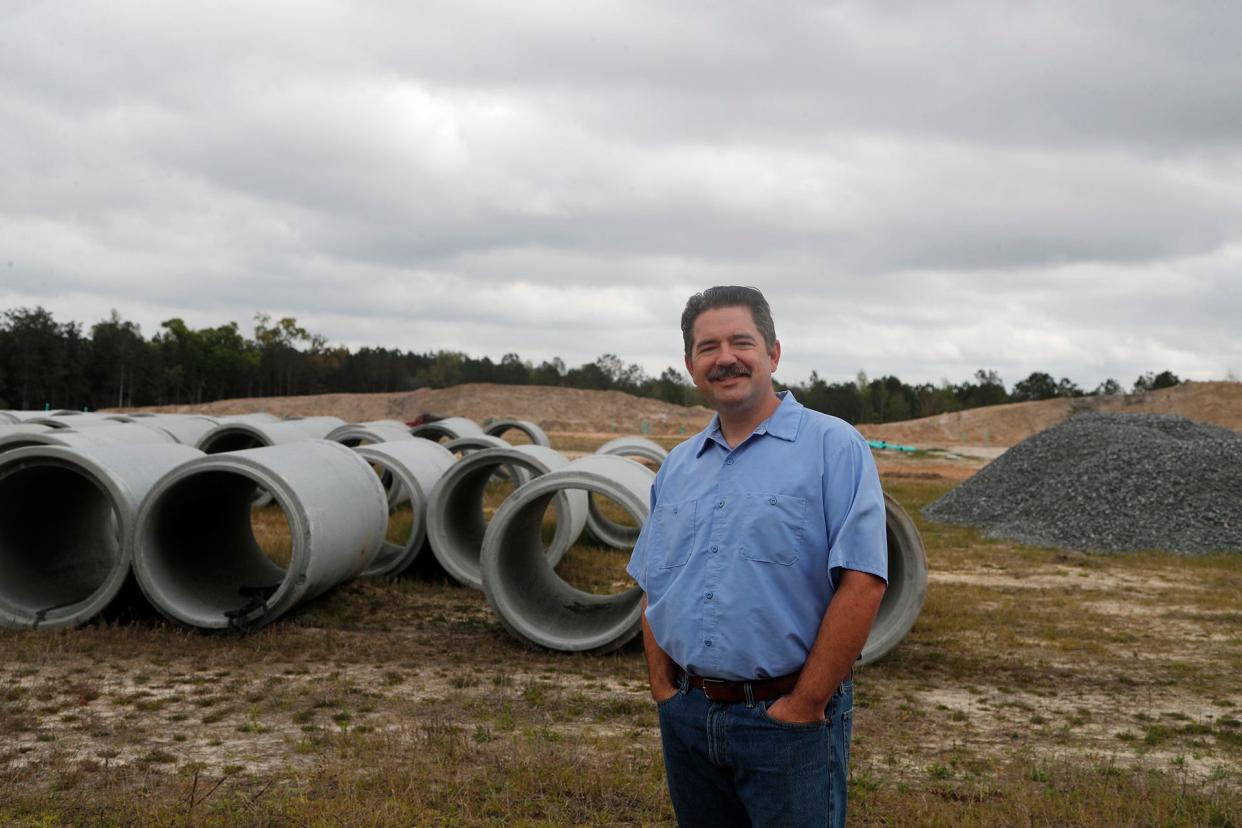 Mayor Russ Deen stands at the site of a new commercial and residential development in Guyton.