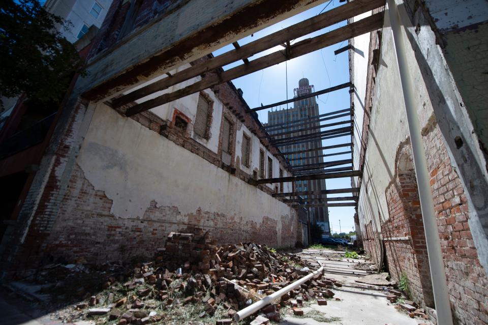 A location of a demolished building in the 100 block of East Capitol Street in downtown Jackson, Miss., remains empty with a second demolished building space next to it Tuesday, Oct. 11, 2022. 