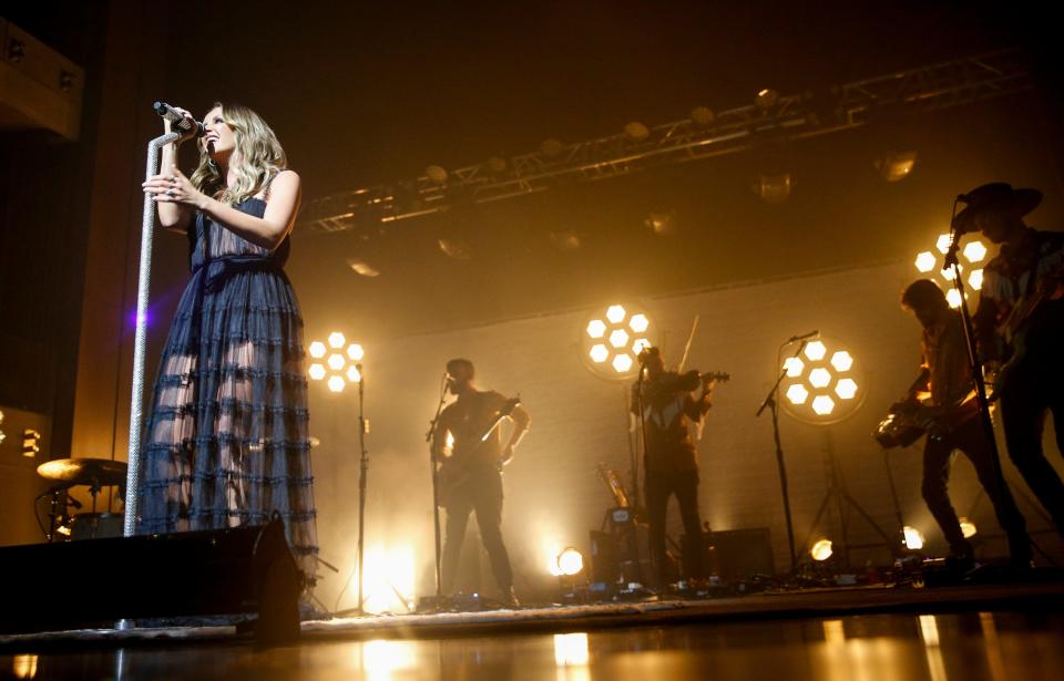 Carly Pearce takes the mic and belts out for a set during Pearce's Nashville stop on her "The 29 Tour" at the CMA Theater in Nashville, Tenn., on Thursday, Dec. 2, 2021. 