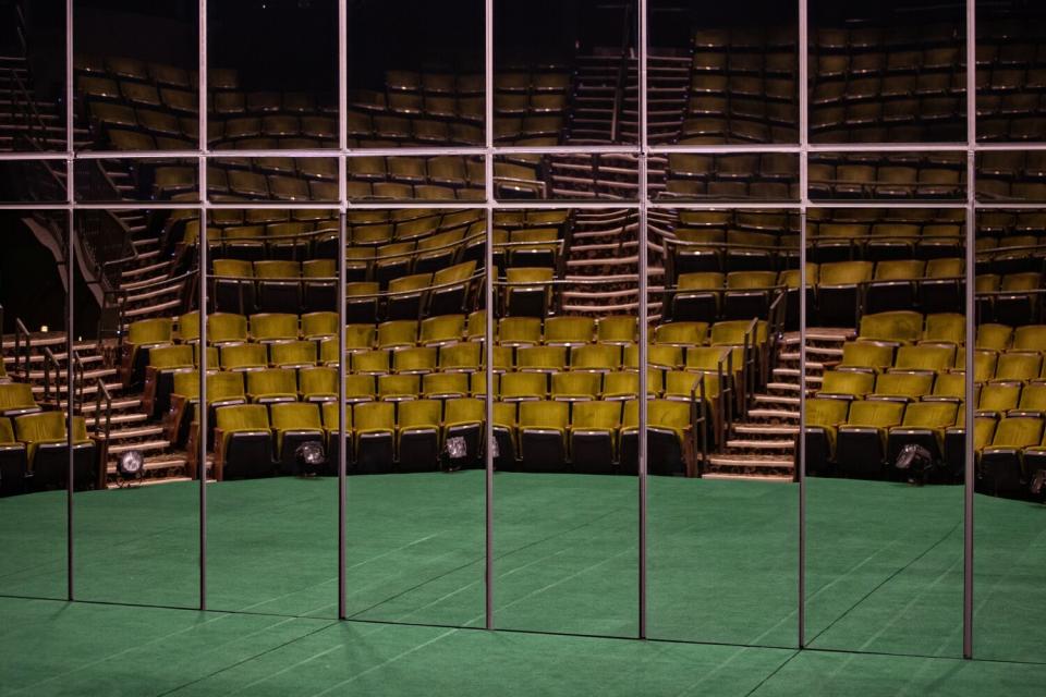 Floor-to-ceiling wall of mirrors line the upstage wall.