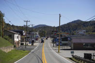 Cars drive along Main Street in Danville, W.Va., on Tuesday, Oct. 13, 2020. Four years after Donald Trump donned a miner’s helmet at a West Virginia campaign rally and vowed to save a dying industry, coal has not come roaring back. The fuel has been outmatched against cheaper, cleaner natural gas and renewable energy. But many West Virginians applaud Trump's efforts and remain loyal as he seeks a second term. (AP Photo/Chris Jackson)