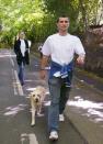 FILE PHOTO: Ireland's captain Roy Keane walks his dog near his home in Hale, Cheshire. The fiery midfielder had been sent home from the World Cup in South Korea and Japan after a row with manager Mick McCarthy at a meeting over training facilities.