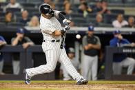New York Yankees' Gleyber Torres hits an RBI-single during the third inning of a baseball game against the Texas Rangers, Monday, Sept. 20, 2021, in New York. (AP Photo/Frank Franklin II)