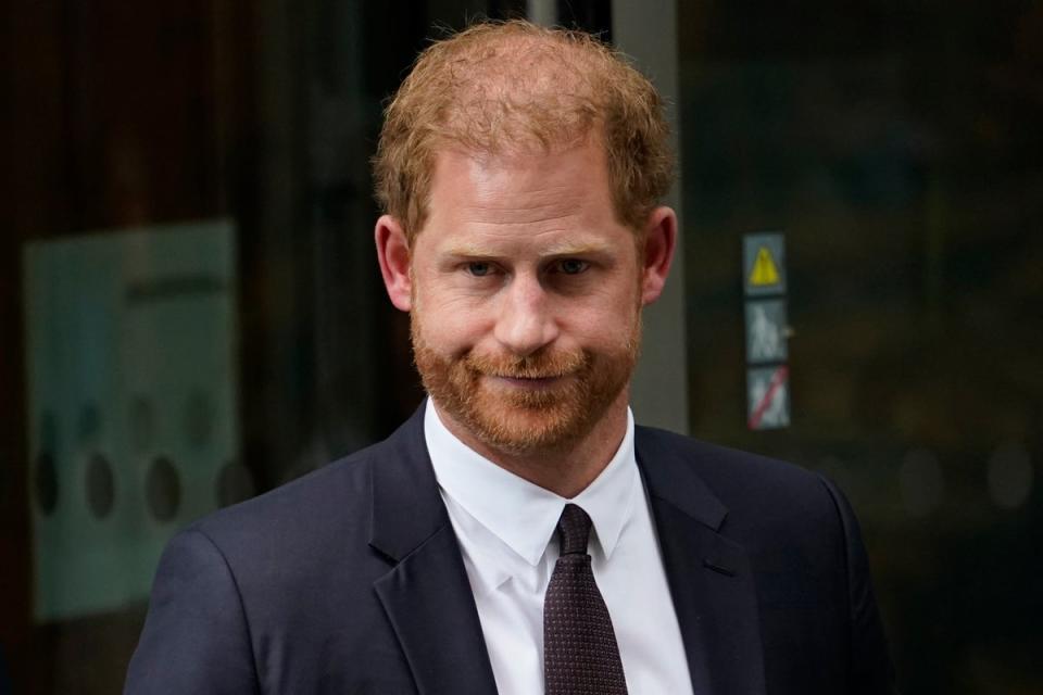 Prince Harry leaves the High Court in June (AP)