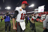 Tampa Bay Buccaneers quarterback Tom Brady (12) reacts as he leaves the field after the team lost to the Los Angeles Rams during an NFL divisional round playoff football game Sunday, Jan. 23, 2022, in Tampa, Fla. (AP Photo/Mark LoMoglio)