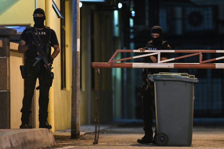 Malaysian police special operation forces keep watch outside the forensics wing of the Hospital Kuala Lumpur, where the body of Kim Jong-Nam is being kept