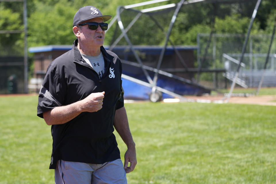 Birmingham-Southern head coach Jan Weisberg directs his team Thursday, May 30, 2024, in Kirtland, Ohio. Birmingham-On Friday, the Panthers will continue an unexpected, uplifting season that has captured hearts across the country by playing in the Division III World Series on the same day the liberal arts college founded on the eve of the Civil War shuts its doors. (AP Photo/Sue Ogrocki)