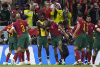 Portugal's Goncalo Ramos (26), celebrates with teammates after scoring the opening goal during the World Cup round of 16 soccer match between Portugal and Switzerland, at the Lusail Stadium in Lusail, Qatar, Tuesday, Dec. 6, 2022. (AP Photo/Manu Fernandez)