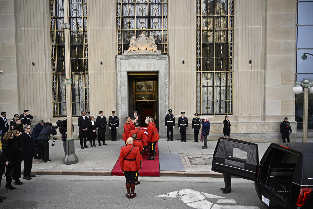 A honour guard carries the casket of former prime minister Brian Mulroney into the Sir John A. Macdonald building opposite Parliament Hill in Ottawa on Tuesday, March 19, 2024. THE CANADIAN PRESS/Justin Tang