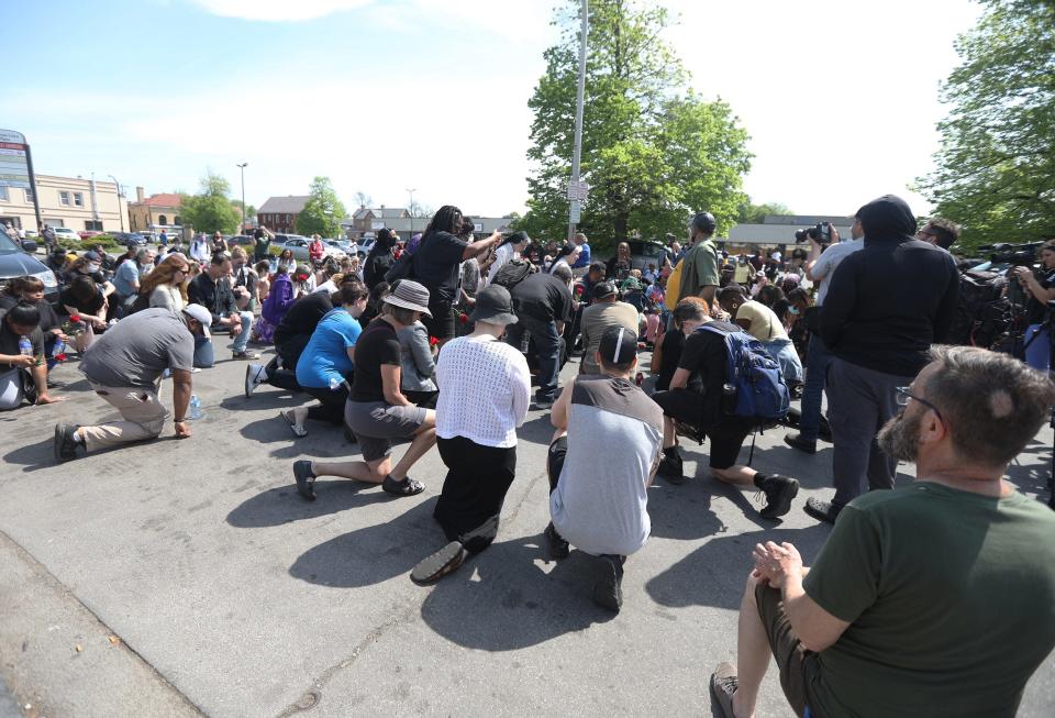 After a march with family members from last night&#39;s shooting, the group stops in front of the Tops Friendly Market on Jefferson Ave., in Buffalo, NY and prays on May 15, 2022. 10 people were killed and three others injured in a shooting at the Buffalo grocery store on May 14, 2022.  
