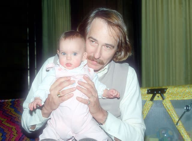 <p>Yvonne Hemsey/Getty</p> John Phillips with daughter Bijou in 1980