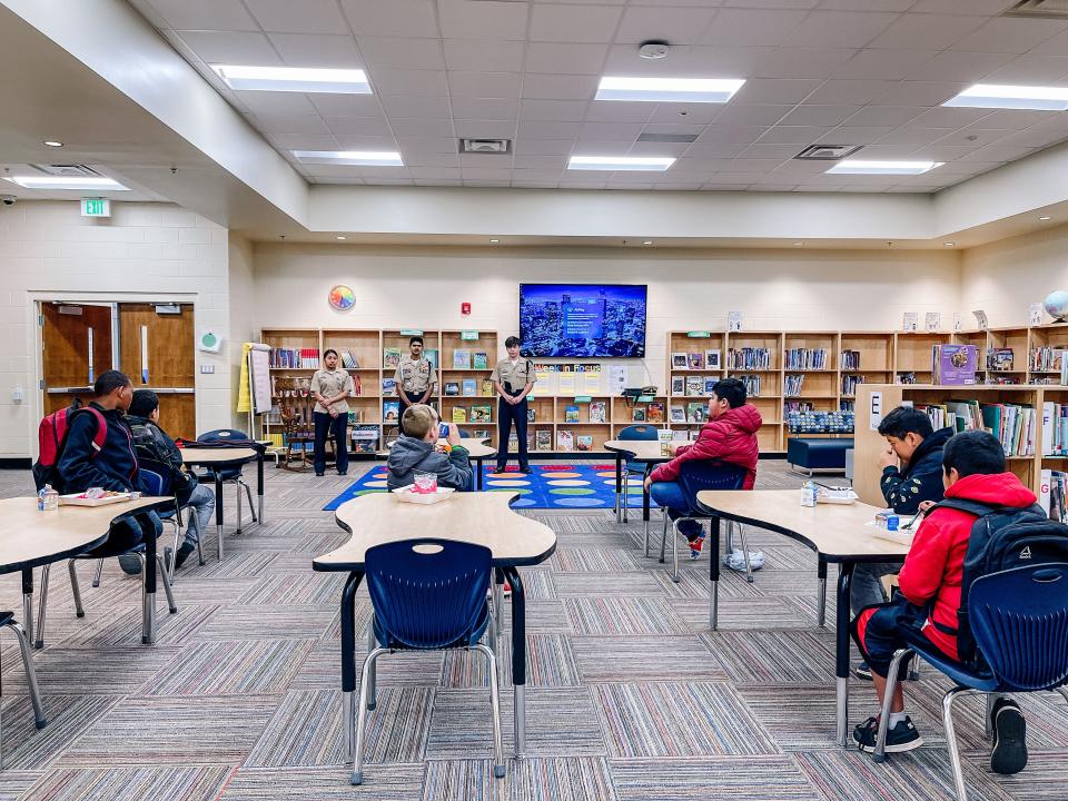 Every week a different group of Central High School students visits Inskip Elementary School to show the different pathways fifth grade students can take in high school. Central High School JROTC members Vilma Castaneda, Deep Mistry and Brodie Trave Hackworth answer questions during a boy’s leadership group breakfast at Inskip Elementary School on March 30, 2022.