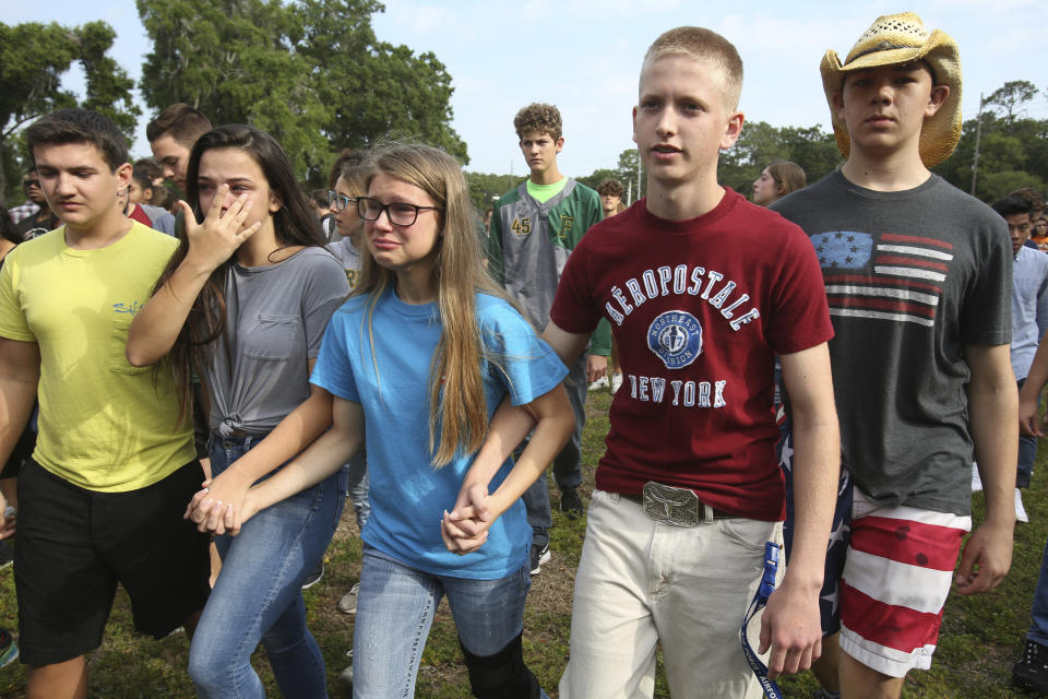 <p>Students are led out of Forest High School after a shooting at the school on Friday, April 20, 2018 in Ocala, Fla. (Photo: Bruce Ackerman/Star-Banner via AP) </p>