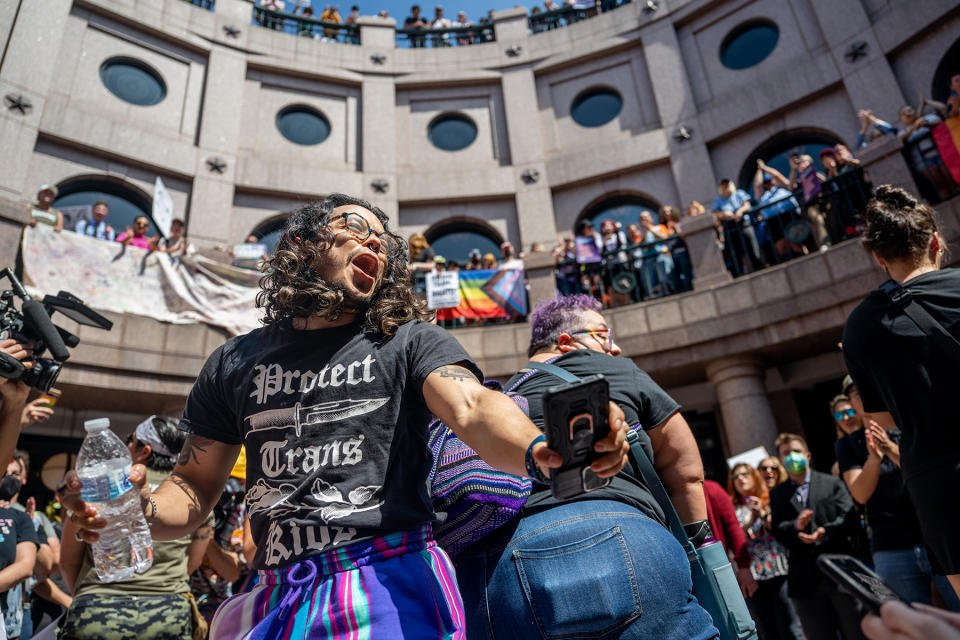 AUSTIN, TEXAS - MARCH 27: People dance together while protesting bills HB 1686 and SB 14 during a 'Fight For Our Lives' rally at the Texas State Capitol on March 27, 2023 in Austin, Texas. Community members and activists gathered at the Capitol to protest the bills, which seek to limit healthcare to transgender youth. (Photo by Brandon Bell/Getty Images)