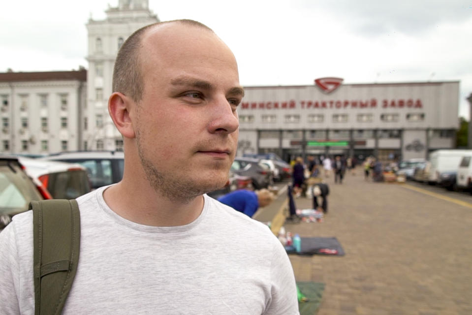 In this photo taken on Friday, Aug. 7, 2020, Kirill Egotin speaks to the Associated Press outside the Minsk Tractor Plant where he works in Minsk, Belarus. "I have grown up under Lukashenko, but poverty, stagnation and helplessness in the fight against the coronavirus have undermined trust in the government. Everybody has got sick of him." (AP Photo/Mstyslav Chernov)