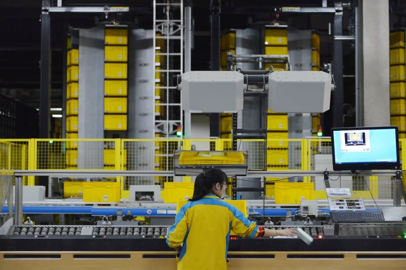 Employee works at a Suning logistics base on the Singles' Day online shopping festival in Nanjing