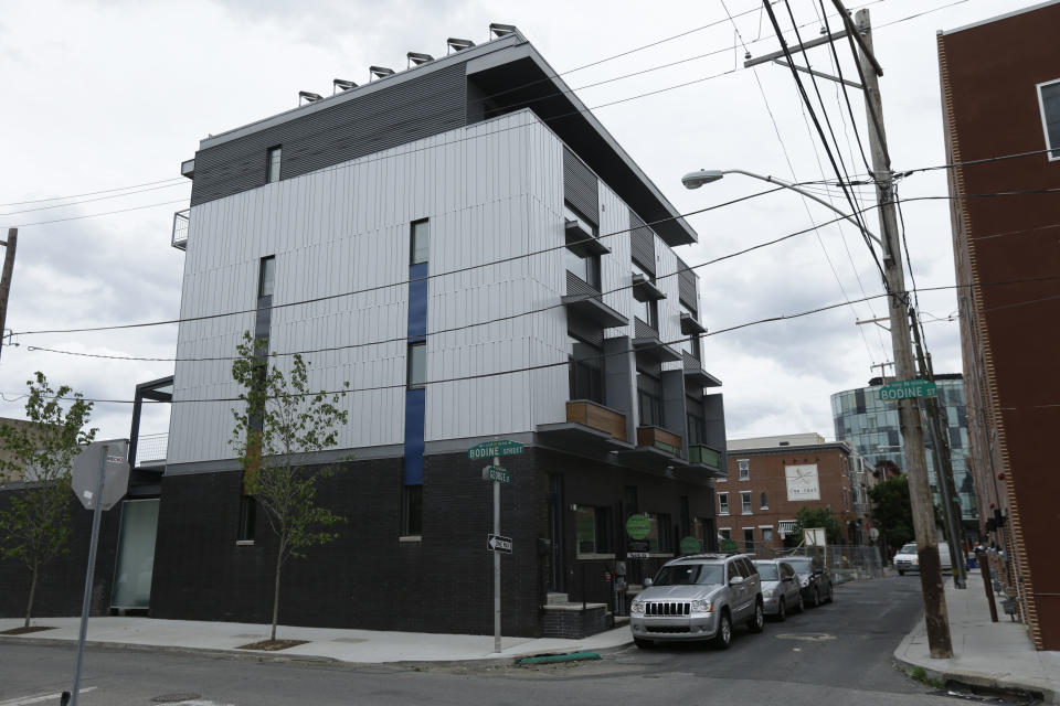 This June 6, 2013 photo shows passive homes in The Stables development in Philadelphia. These homes are built around the idea that houses can be airtight, super-insulated and energy efficient. The goal: a house that creates nearly as much energy as it consumes. (AP Photo/Matt Rourke)