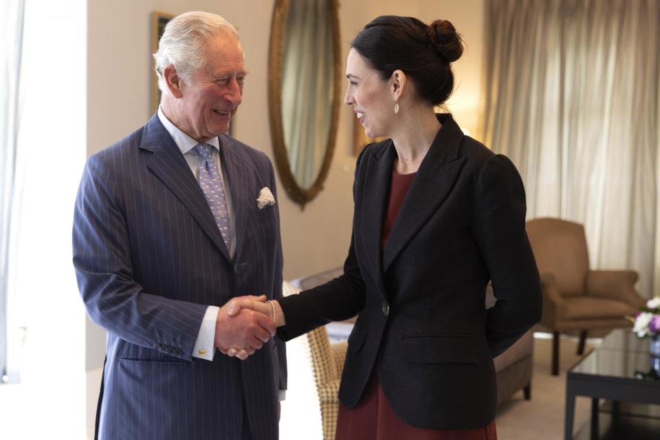 Prince Charles shakes hands with New Zealand Prime Minister Jacinda Ardern at Government House in Auckland on Tuesday (AP)