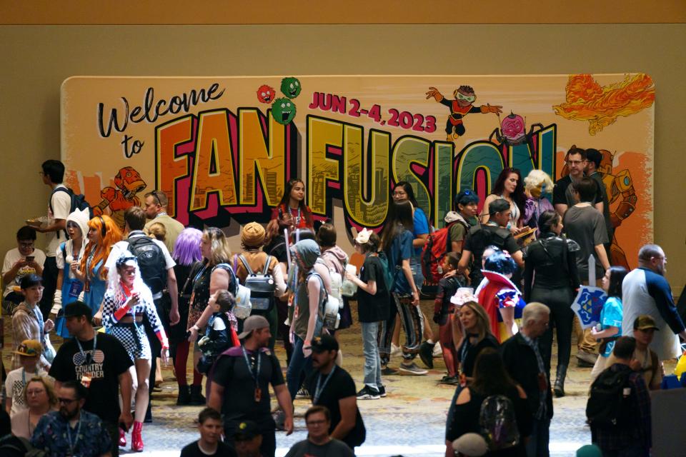 Crowds of people gather in front of a "Welcome to Fan Fusion" sign as the event takes place at the Phoenix Convention Center on June 4, 2023, in Phoenix.