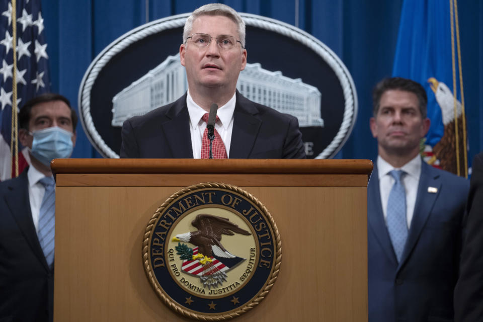 Special Agent in Charge of the Criminal and Cyber Division of the FBI's Washington Field Office James Dawson speaks, Wednesday, Sept. 16, 2020 at the Justice Department in Washington. The Justice Department has charged five Chinese citizens with hacks targeting more than 100 companies and institutions in the United States and abroad, including social media and video game companies as well as universities and telecommunications providers. Officials announced the prosecution on Wednesday. (Tasos Katopodis/Pool via AP)