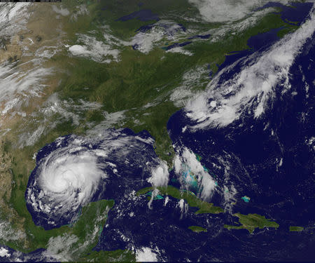 Tropical Storm Harvey is seen approaching the Texas Gulf Coast, U.S., in this NOAA GOES East satellite image taken at 10:07 ET (14:07 GMT) August 24, 2017. NOAA/Handout via Reuters