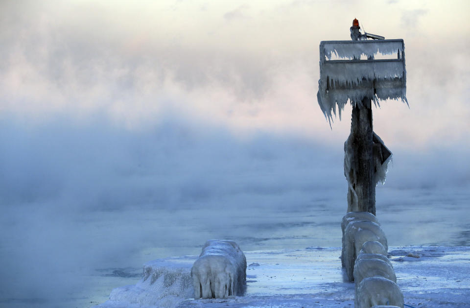 A harbor light is covered by snow and ice on the Lake Michigan at 39th Street Harbor, Jan. 30, 2019, in Chicago. (Photo: Nam Y. Huh/AP)