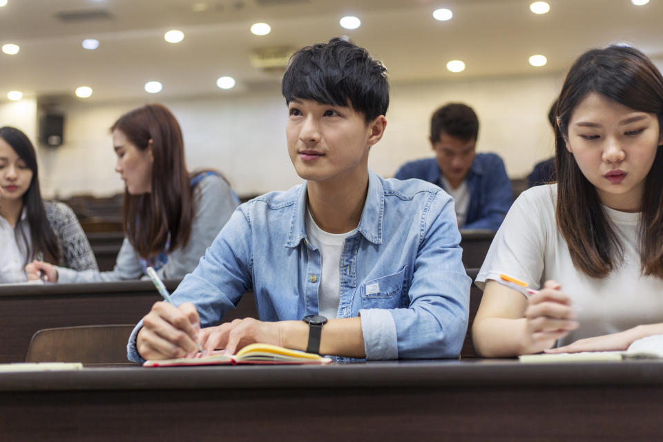 A student taking notes