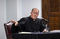 Superior Court Judge Timothy Walmsley gives instructions to a pool of prospective jurors during jury selection for the trial of Greg and Travis McMichael and William "Roddie" Bryan, at the Glynn County Courthouse, Monday, Oct. 25, 2021, in Brunswick, Ga. The trio are charged with the slaying of 25-year-old Ahmaud Arbery in February 2020. (AP Photo/Stephen B. Morton, Pool)