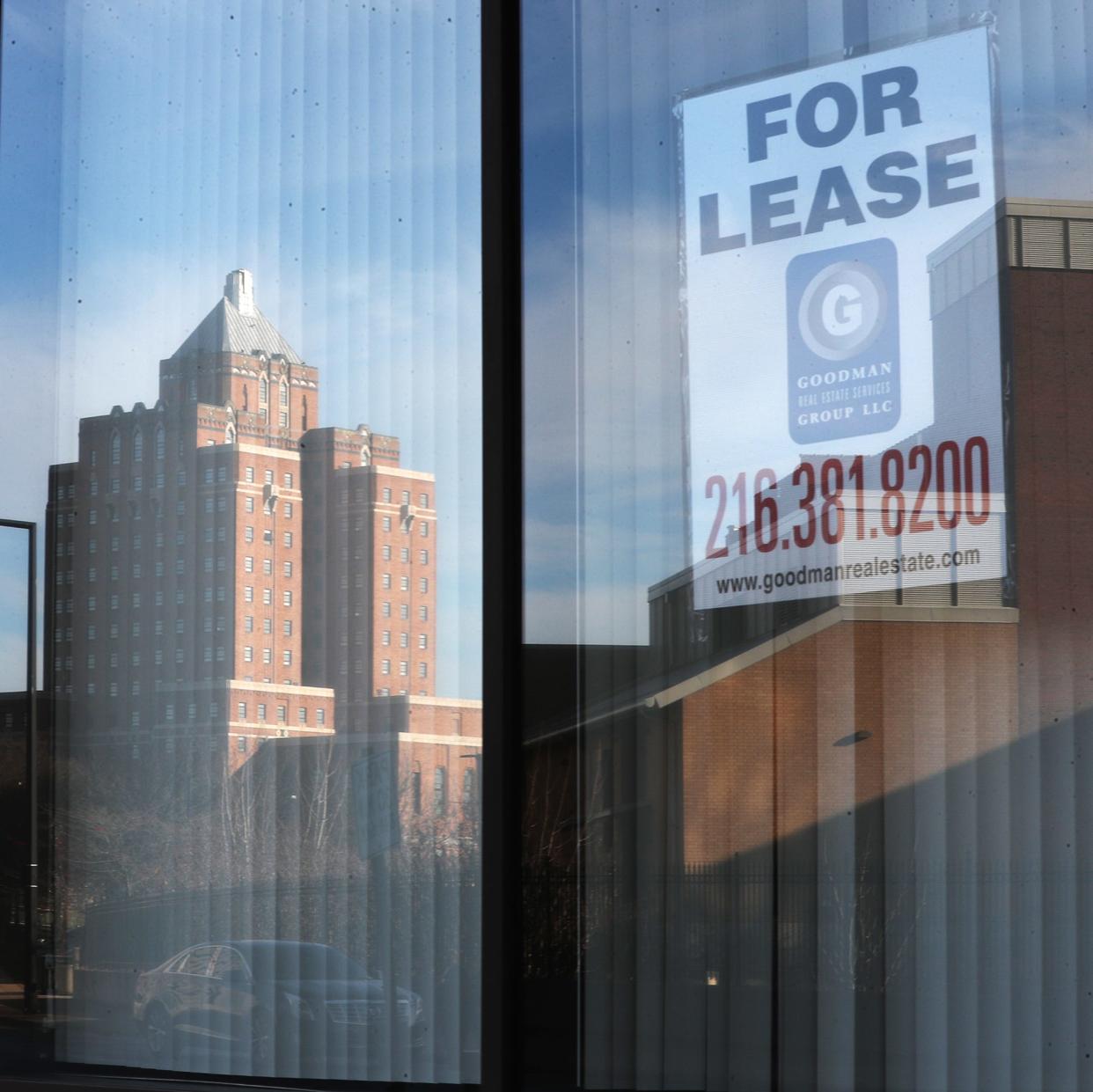 The Canal Square Lofts are reflected in a window of the PNC Center in downtown Akron.