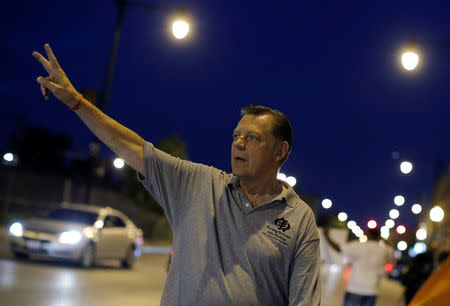 Father Michael Pfleger demonstrates in the streets during a weekly night-time peace demonstration in a South Side neighborhood in Chicago, Illinois, U.S. September 16, 2016. Picture taken September 16, 2016. REUTERS/Jim Young