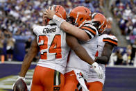 Cleveland Browns running back Nick Chubb (24) is hugged by quarterback Baker Mayfield (6) and wide receiver Jarvis Landry after scoring on a touchdown run against the Baltimore Ravens during the second half of an NFL football game Sunday, Sept. 29, 2019, in Baltimore. (AP Photo/Brien Aho)