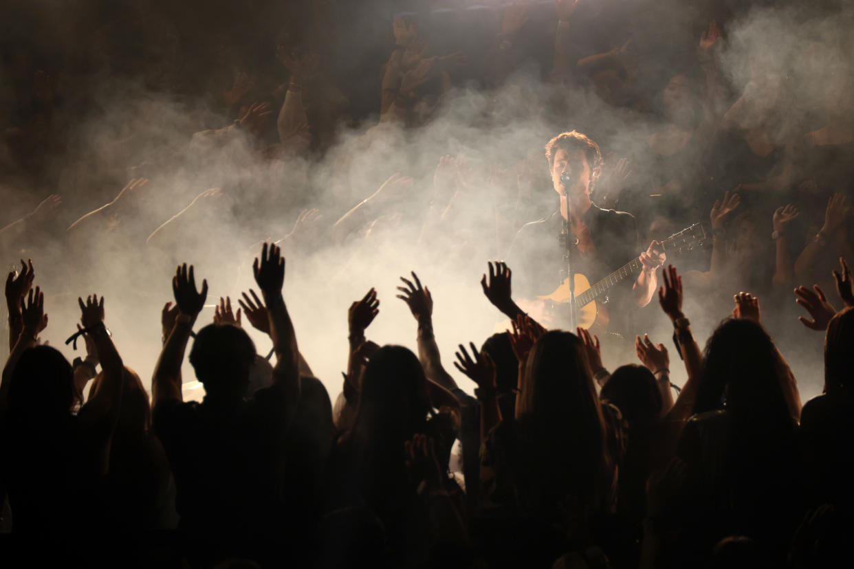 Shawn Mendes performs on stage.