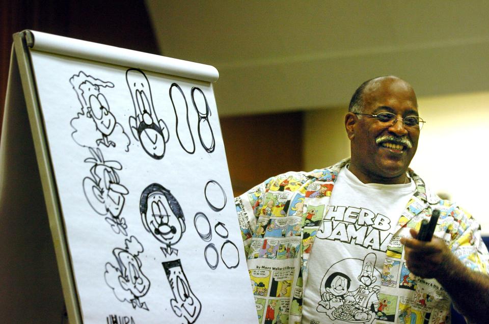 Stephen Bentley, creator of the "Herb and Jamaal" comic strip, talks about his craft during and gives a drawing demonstration a lecture at the Cesar Chavez central library in downtown Stockton on May 5, 2005