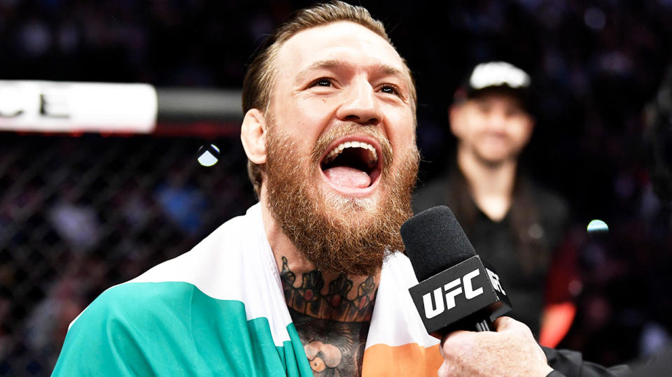 Conor McGregor smiles and laughs after his victory in the UFC.