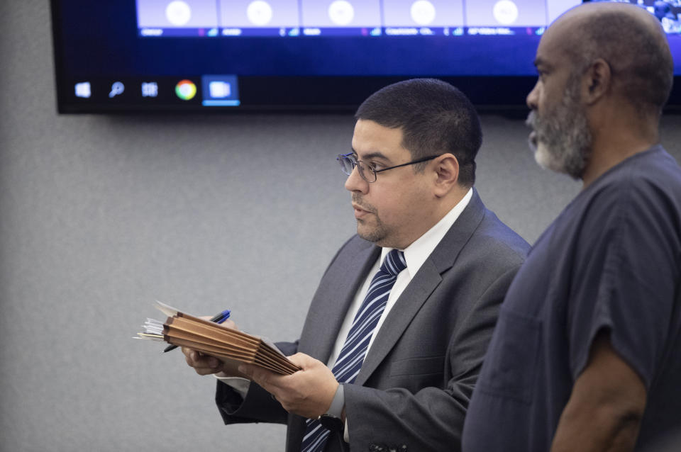 Defense attorney Robert Arroyo, left, stands by Duane "Keffe D" Davis as Davis makes an appearance in Clark County District Court Tuesday, Nov. 7, 2023, in Las Vegas. Davis was arrested in September and has pleaded not guilty to murder in the 1996 killing of rapper Tupac Shakur. (Steve Marcus/Las Vegas Sun via AP, Pool)