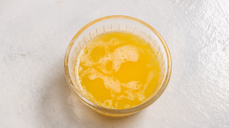 Melted butter in a glass bowl