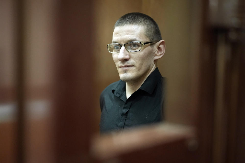 Robert Woodland, a Russia-born U.S. citizen, stands in a glass cage prior to a court hearing, Thursday, July 4, 2024, in Moscow, Russia. Woodland was convicted of drug-related charges and sentenced to 12 and a 1/2 years in prison on Thursday. (AP Photo/Alexander Zemlianichenko)