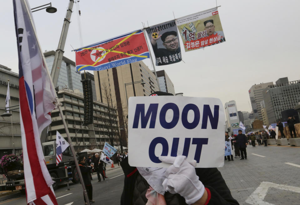 FILE - In this Nov. 17, 2018 file photo, a protester marches during a rally to denounce policies of South Korean President Moon Jae-in on North Korea in Seoul, South Korea. The upcoming Trump-Kim meeting will be a crucial moment for South Korean President Moon Jae-in, who is desperate for more room to continue his engagement with North Korea, which has been limited by tough U.S.-led sanctions against Pyongyang. (AP Photo/Ahn Young-joon, File)