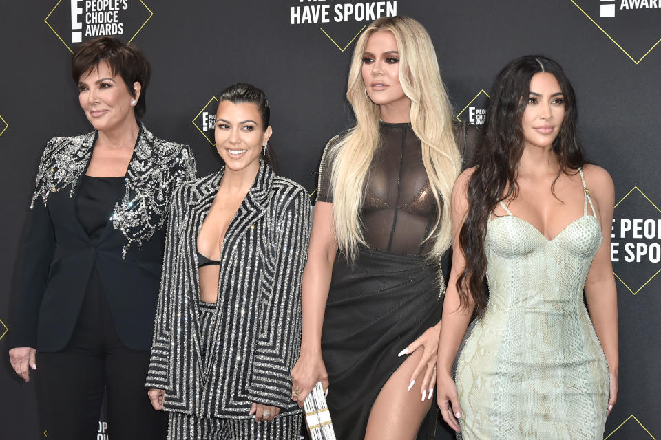 Kris, Kourtney, Khloé, and Kim at a media event