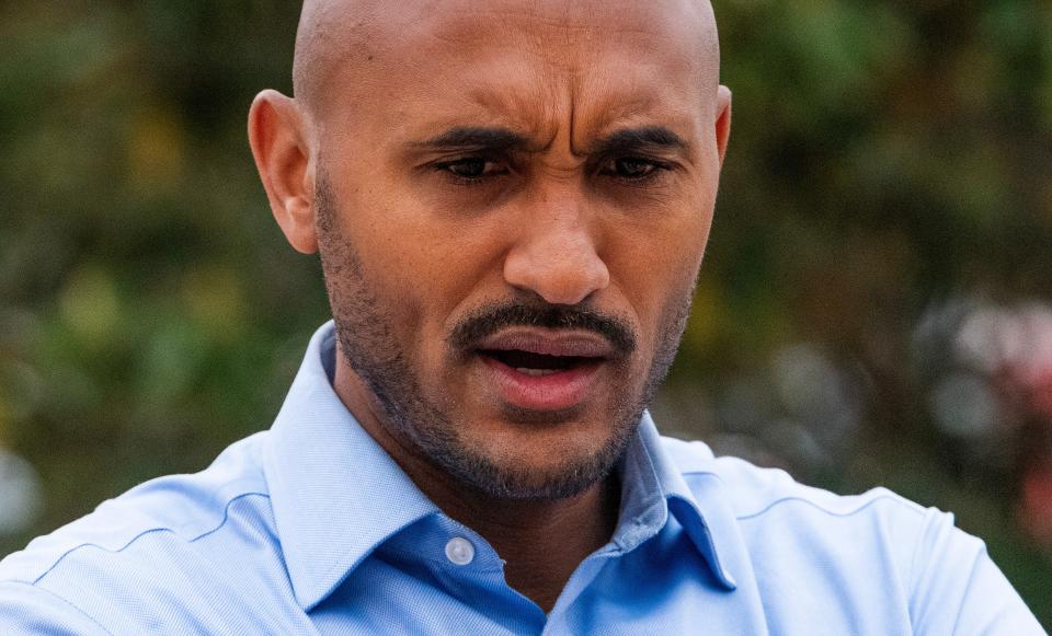 Shomari Figures talks with voters outside of the Frazer Church polling place during the runoff election in Montgomery, Al., on Tuesday April 16, 2024.