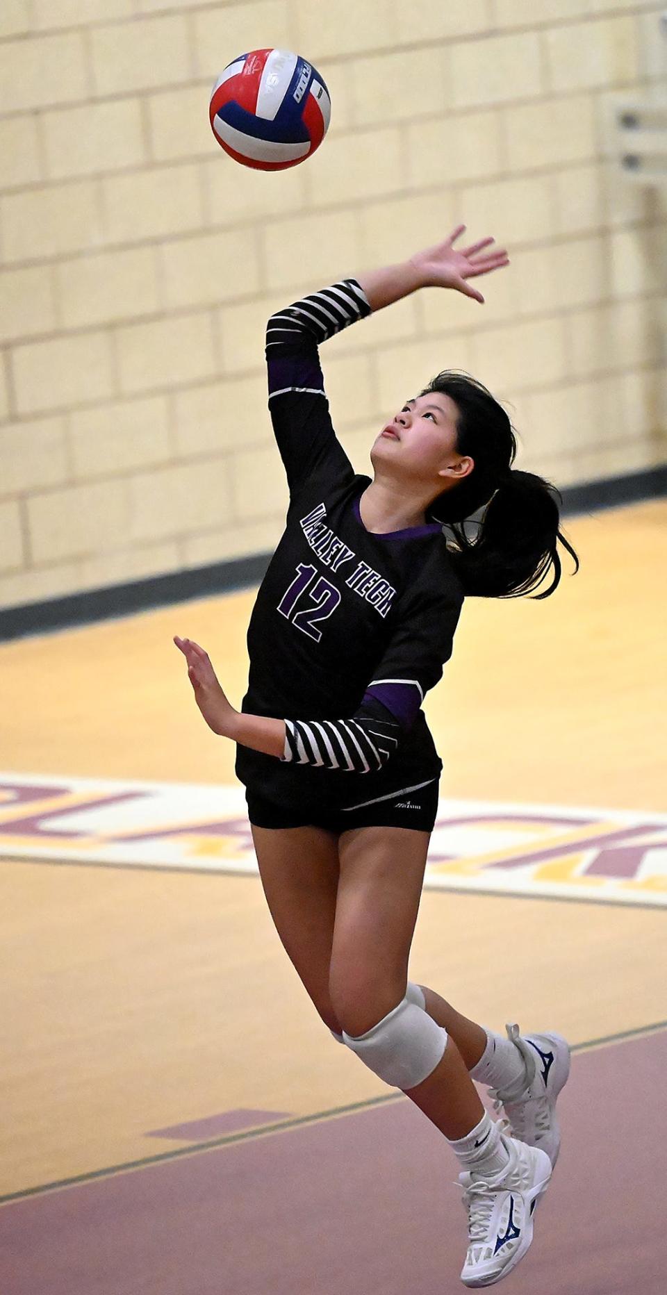 Blackstone Valley Tech's Emma Shum serves during an MIAA Div. 4 Round of 32 tournament match against Malden Catholic at Blackstone Valley Tech in Upton, Nov. 3, 2022.   