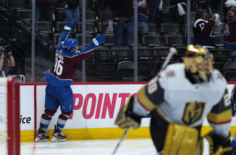 Colorado Avalanche right wing Mikko Rantanen (96) celebrates his overtime goal against Vegas Golden Knights goaltender Marc-Andre Fleury, foreground, in Game 2 of an NHL hockey Stanley Cup second-round playoff series Wednesday, June 2, 2021, in Denver. (AP Photo/Jack Dempsey)