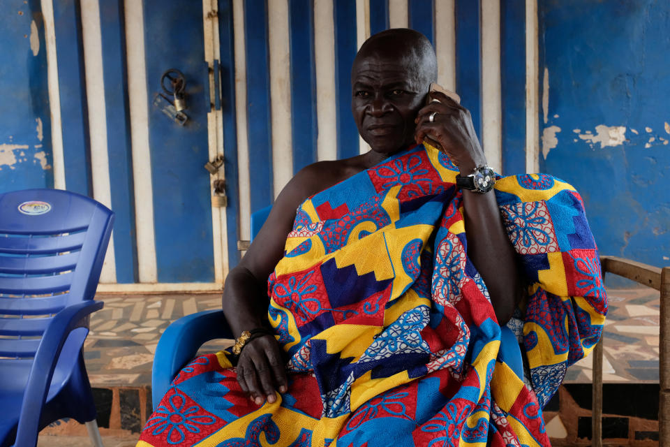 Nana Assenso, chief of Adidwan, a village in Ghana's interior, before visiting the grave of his uncle Kwame Badu, in Adidwan, Ashanti region, Ghana. His uncle's name, Kwame Badu, has been passed on through the family in remembrance of an ancestor with that name who was captured and sold into slavery. (Photo: Francis Kokoroko/Reuters)