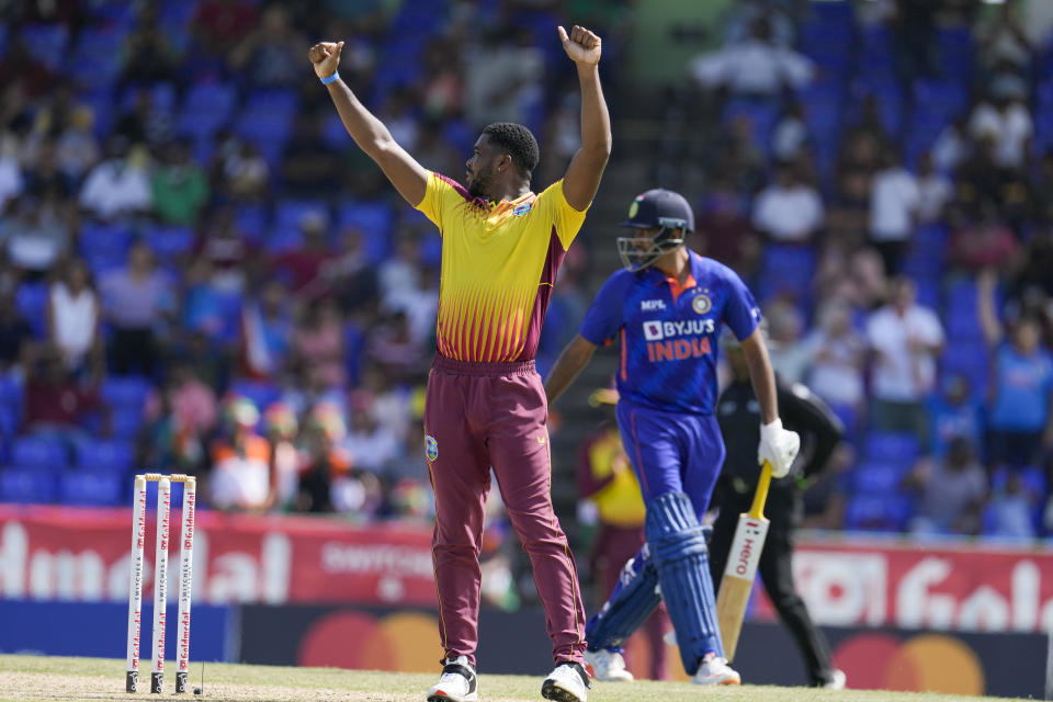 West Indies' Obed McCoy celebrates taking the wicket of India's Ravichandran Ashwin during the second T20 cricket match at Warner Park in Basseterre, St. Kitts and Nevis, Monday, Aug. 1, 2022. (AP Photo/Ricardo Mazalan)